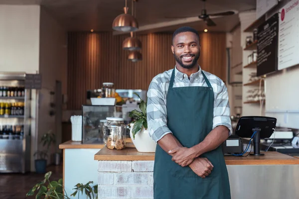 Entrepreneur standing in front of business