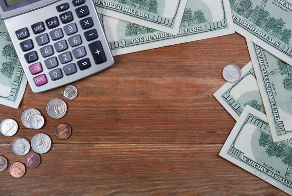 calculator and money on a table